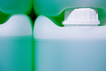 White drums whit a green liquid inside