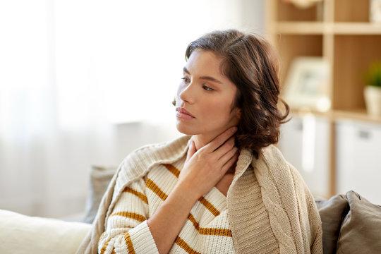 Cold And Health Problem Concept - Unhappy Sick Woman With Sore Throat At Home