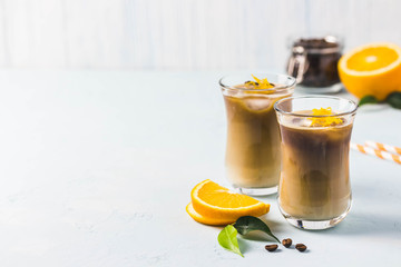 Citrus iced chai latte. Selective focus, space for text.