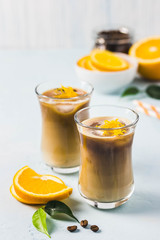 Creamy orange iced coffee . Selective focus, space for text.