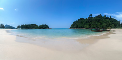 Panorama Koh Kam Tok Ranong, Thailand, White sand beach and crystal-clear beautiful Andaman sea and Long-tail boat Ranong Province, Thailand.