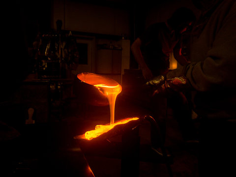 Glassblower working in workshop