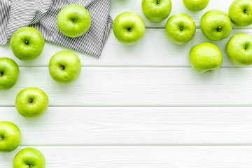 green apples for organic summer food pattern on light wooden background top view mockup