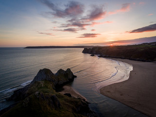 Aerial view of Three Cliffs Bay south coast beach the Gower Peninsula Swansea Wales uk