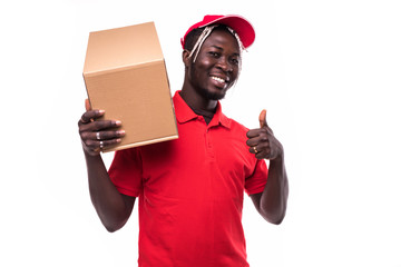 Delivery Concept. Portrait of Happy African American delivery man holding a box package and showing thumbs up isolated on white background