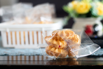 Milk cracker cookies Served with hot coffee on wooden desk