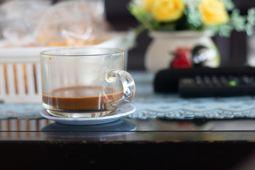 A coffee cup on wooden desk