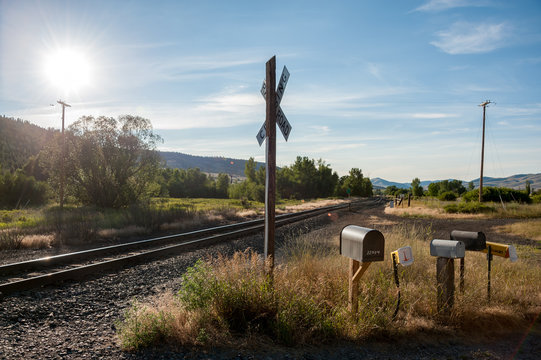 View of railway track passing through grassy landscape