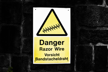 Razor wire warning sign