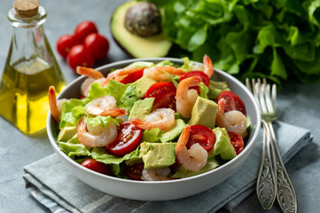 Salad with shrimps, avocado and cherry tomatoes.