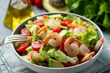 Salad with shrimps, avocado and cherry tomatoes.