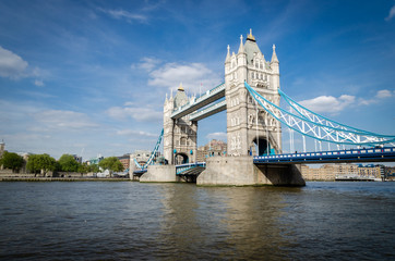 Fototapeta na wymiar London city / England - May 2014: Tower Bridge and blue sky