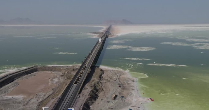 Aerial photography. From a bird's eye view of the road that crosses the salty lake Urmia, Iran. 4k.