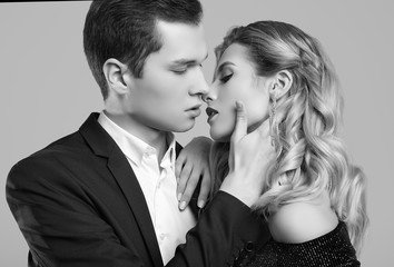 Sensual beautiful young couple dressed in formal clothes