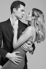 Sensual beautiful young couple dressed in formal clothes
