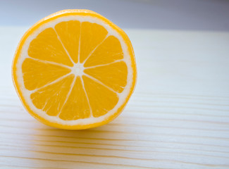 fresh lemon on wooden background with space for notes