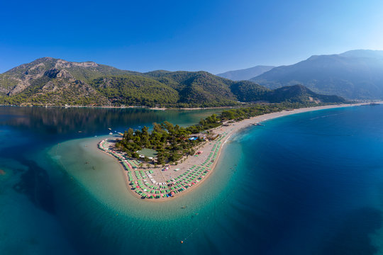 Aerial view of coastline with mountains against clear sky