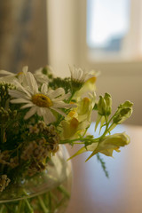 bouquet of flowers in a vase sitting on a table
