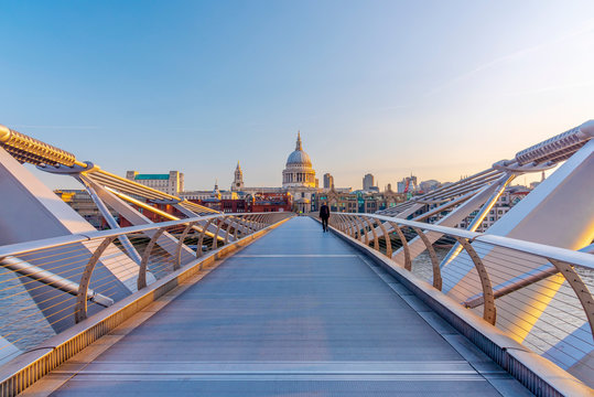 View of Millennium Bridge with St. Paul's Cathedral against clear sky