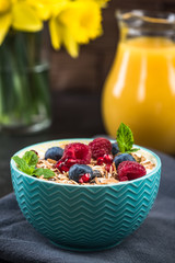 Muesli in bowl with fresh berry fruits