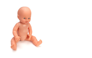 Baby doll toy on white background.