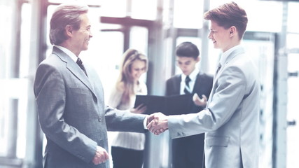 Business people shaking hands, finishing up meeting