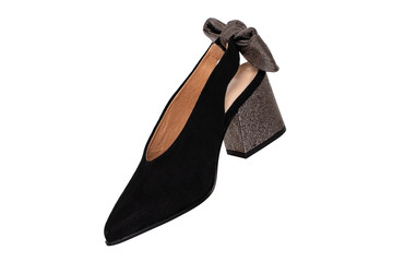 Leather shoes isolated. A elegant female suede shoe decorated with silver bow isolated on a white background. Shoe fashion 2019.