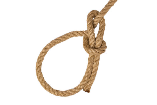 Rope isolated. Closeup of figure Palstek sailors knot or node from a brown rope isolated on a white background. Navy and marine knot or sailors knot. Macro.