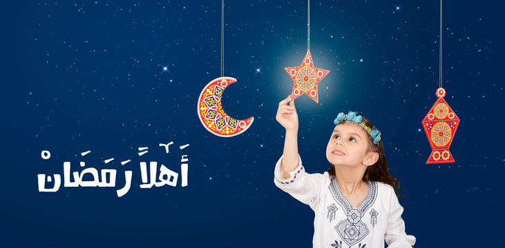 Greeting Card : Ahlan Ramadan -  Arabic Translation : Welcome Holy Month : Ramadan - Happy young Muslim girl celebrating Ramadan