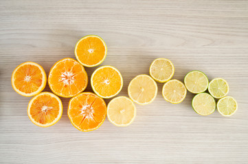 Citric fruits over wood background