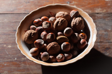 Hazelnut on the wooden plate
