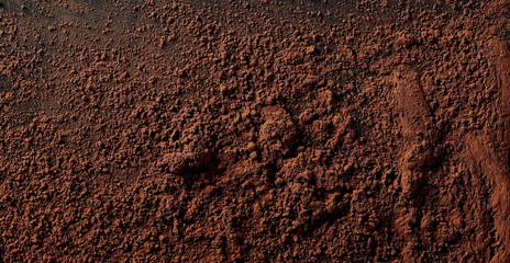  Cocoa powder pile isolated on black background, top view