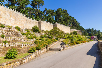Naklejka premium Baiona, Spain. The wall of the fortress of Monterreal, XI - XVII centuries. The fortress is included in the list of the most picturesque historical buildings of UNESCO