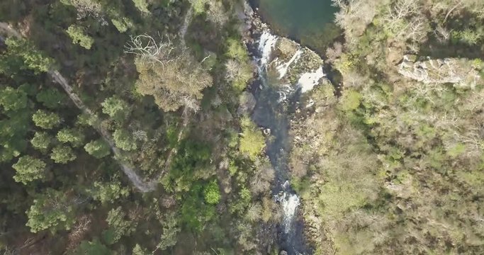 Aerial view of drone, with river landscape, Vouga river and banks with typical Portuguese vegetation, on the mountains, in north Portugal