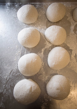 Homemade Bread or Pizza Dough Balls Proofing on Metal Tray Before Baking