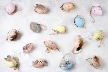 Decorative Easter eggs on stone background. Easter background. Pattern of Easter eggs top view