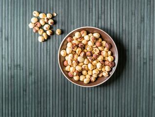 Healthy food  for background image close up hazelnuts.  Nuts texture on top view on the cup plate
