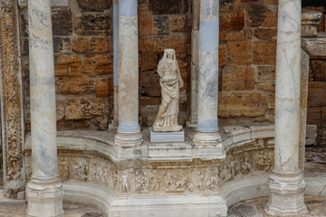 The ruins of the ancient ancient city of Hierapolis with columns, gates and graves in Pamukalle, Turkey