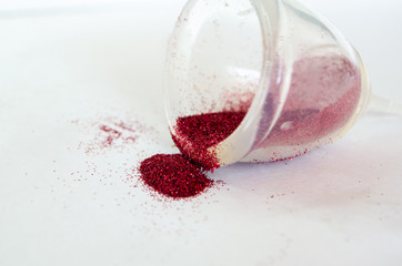  menstrual cup with red glitter. Menstruation concept