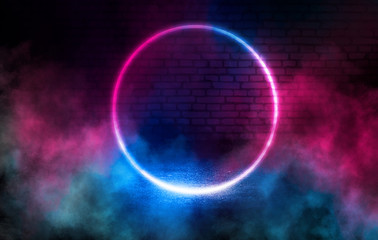Background empty scene, room. Reflection on wet asphalt, concrete. Neon blurry lights. Neon circular figure on a brick wall background, smoke