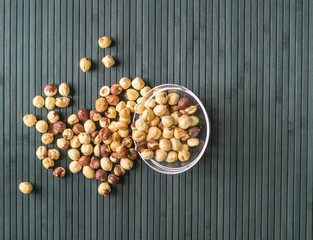 Healthy food  for background image close up hazelnuts.  Nuts texture on top view on the cup plate