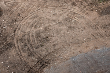 Traces of wheels inside of mud