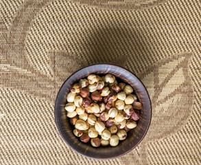 Healthy food  for background image close up hazelnuts.  Nuts texture on top view on the cup plate