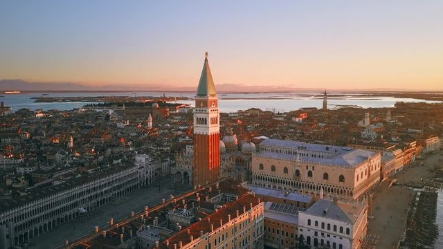 venice aerial view drone at sunrise fly around orbit over st mark square cut one italy