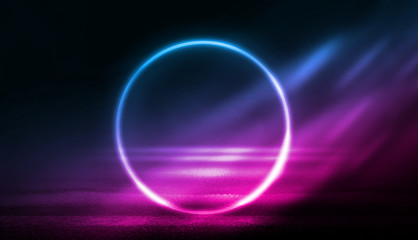 Background of empty stage, room. Reflection on wet pavement, concrete. Neon blurry lights. Neon circle figure in the center, smoke