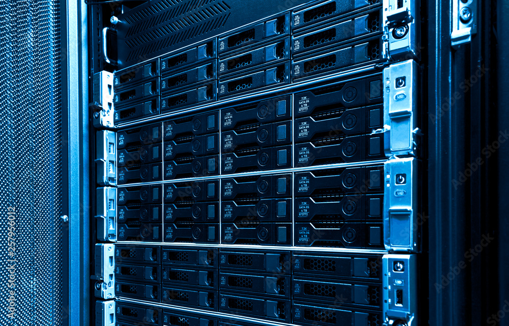 Poster high capacity hard drive disk storage rack used for big data cloud services inside data server room 