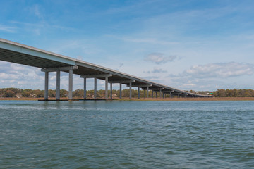 Beautiful, long concrete beam bridge spans the inter coastal waters of Hilton Head Island, South Carolina, USA.