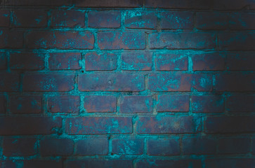 The background of an empty room with brick walls and concrete floor tiles. Neon light, spotlight