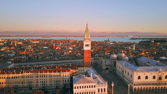 venice aerial view drone at sunrise fly around orbit over st mark square cut two italy