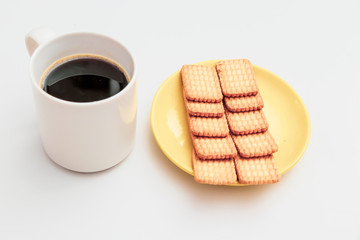 Obraz na płótnie Canvas Cup of coffee and biscuit on table Flat lay